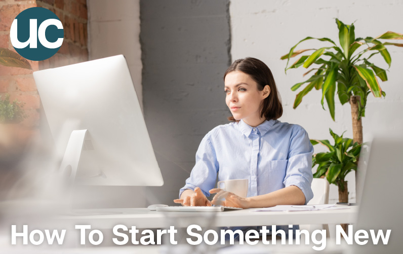 How To Start Something New Featured Image: A woman sits in front of her computer ready to begin a new project.